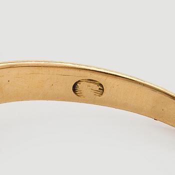 An 18K gold ring with old-cut diamonds.
