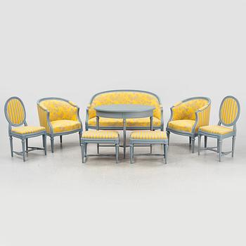 A painted sofa, table, a pair of chairs, a pair of armchairs, a pair of stools, Gustavian style, 20th Century.