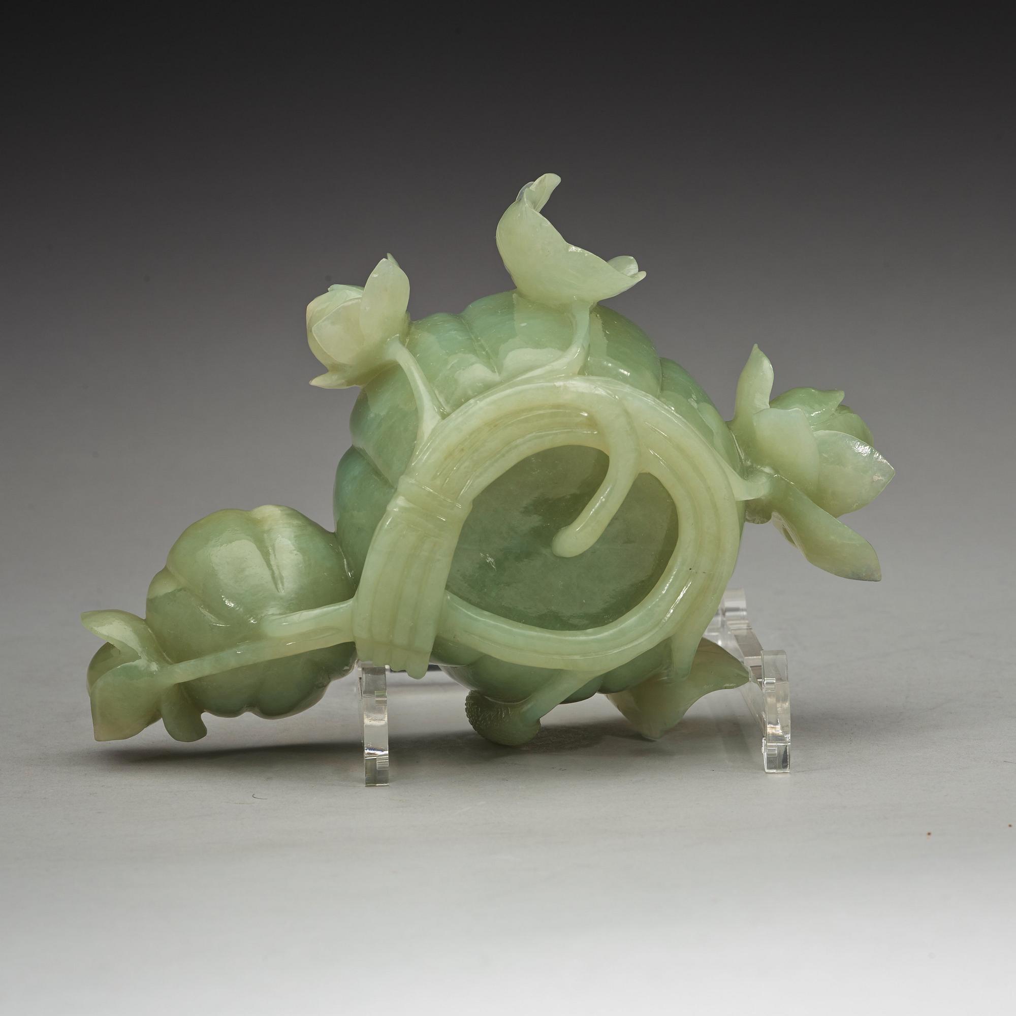 A Chinese lotusshaped serpentine stone brush washer.