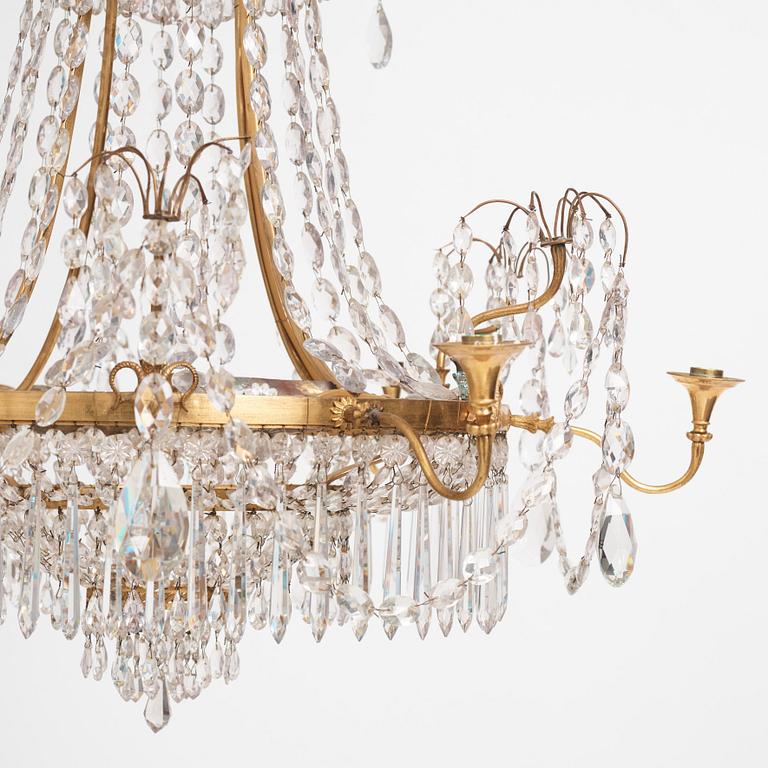 A German Louis XVI gilt-brass and cut-glass six-light chandelier, late 18th century.