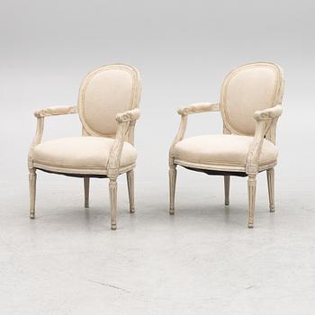 A pair of Gustavian style chairs, circa 1900.