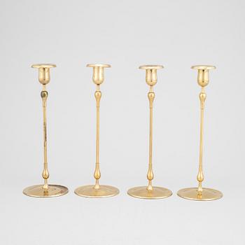 Gunnar Ander, a set of four brass candlesticks from Ystad Metall.