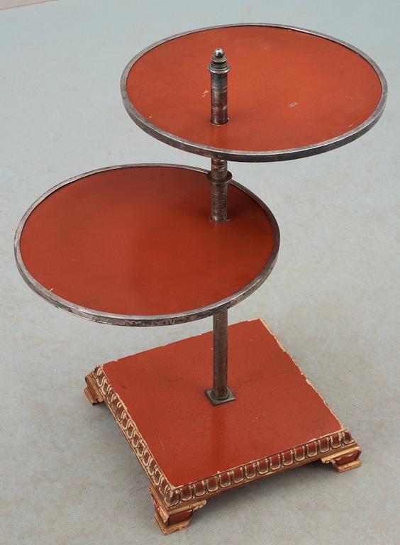 An Axel-Einar Hjorth red lacquer table 'Åbo' on a silver plated brass leg, Nordiska Kompaniet (NK) 1929-30.