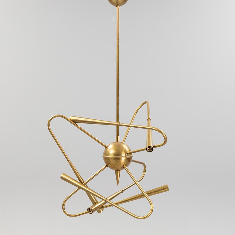 A mid 20th Century brass celiling light.