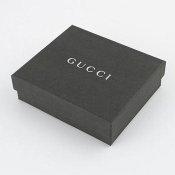 Gucci, a leather and canvas wallet, 1999.