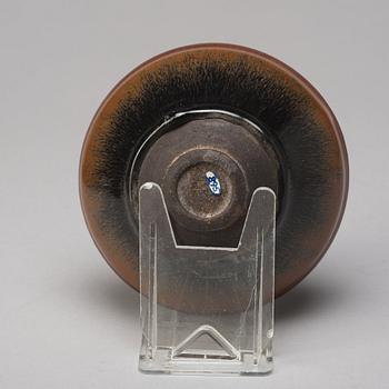 A group of three brown glazed bowls, China, 20th Century.