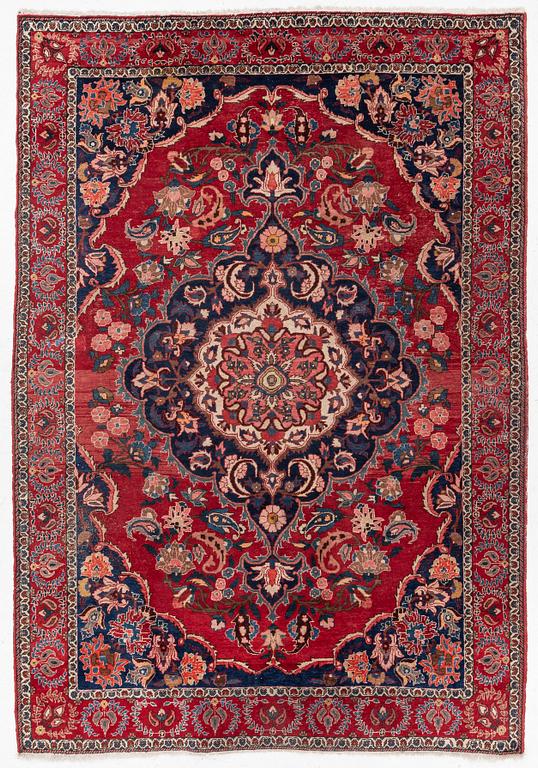 An Persian carpet, ca. 310 x 215 cm.