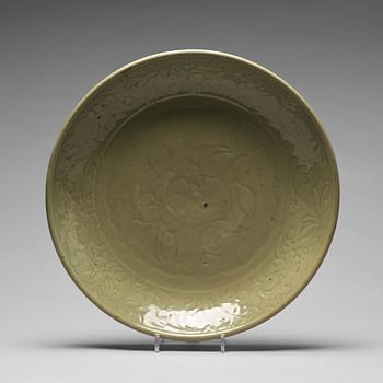 A large celadon glazed dish, Ming dynasty (1368-1644).