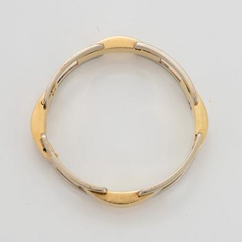 An 18K gold and white gold Cartier bracelet.