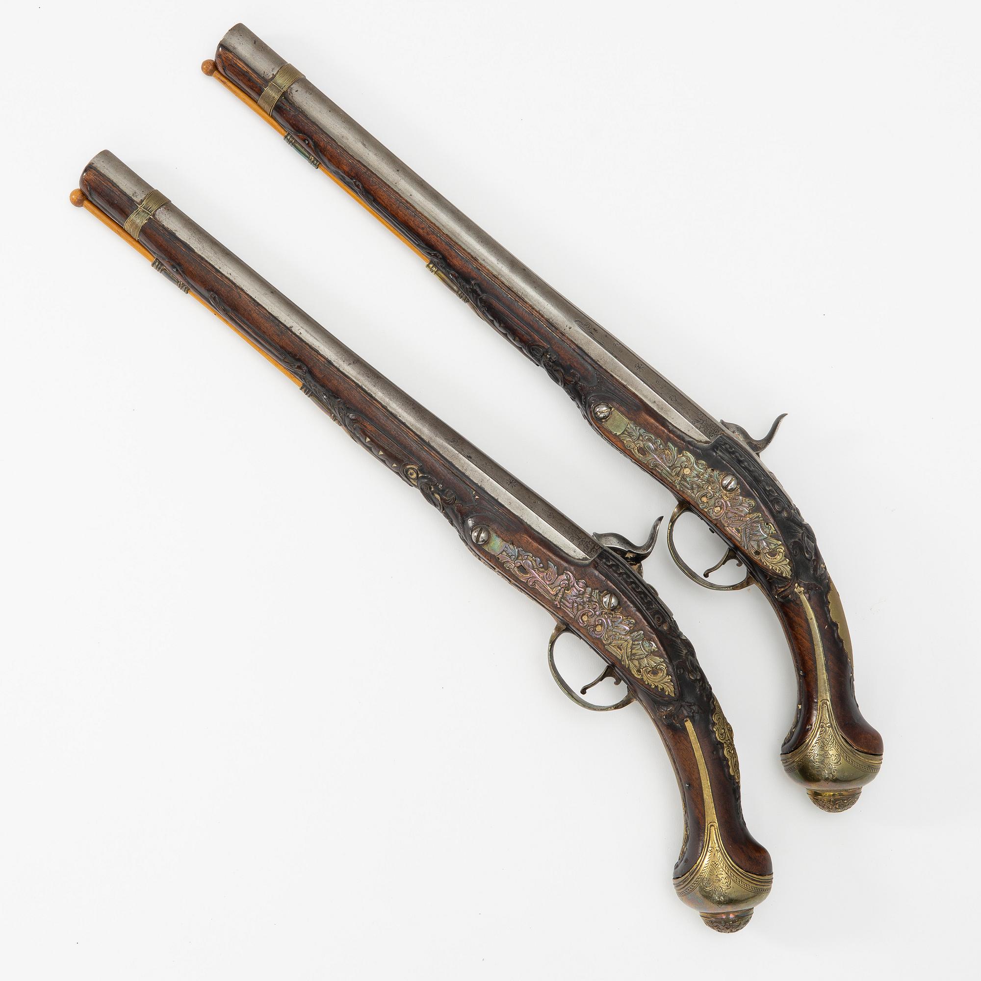 A pair of percussion pistols, converted from flintlock. 18th century.