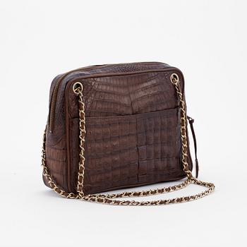 CHANEL, a brown crocodile shoulderbag from the 1980s.