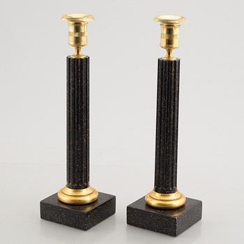 A pair of porphyry imitation candlesticks, 20th century.