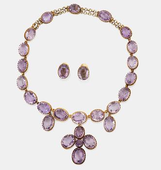 977. A necklace and a pair of earrings in silver set with amethysts.