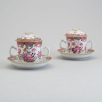 A pair of famille rose cups with covers and stands, Qing dynasty, Qianlong (1736-95).