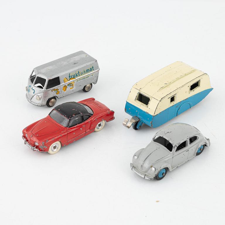 Nine toy cars, mostly Dinky toys.