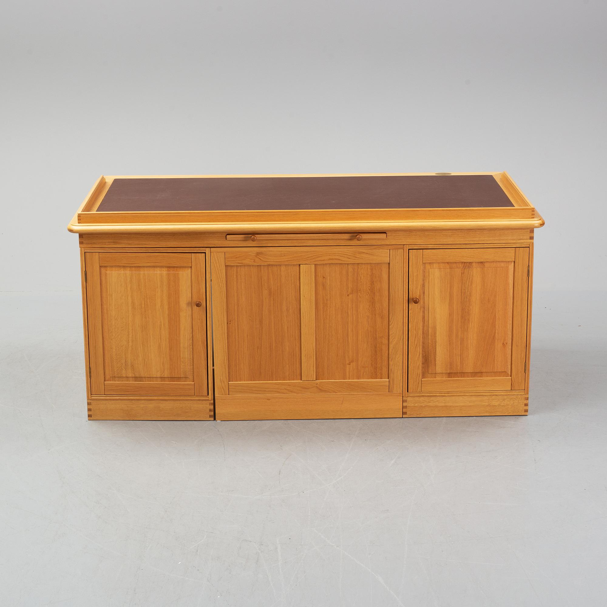 An oak writing desk by Finn N Hansen. End of the 20th Century.