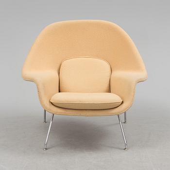 EERO SAARINEN, a "Womb chair" by knoll international.