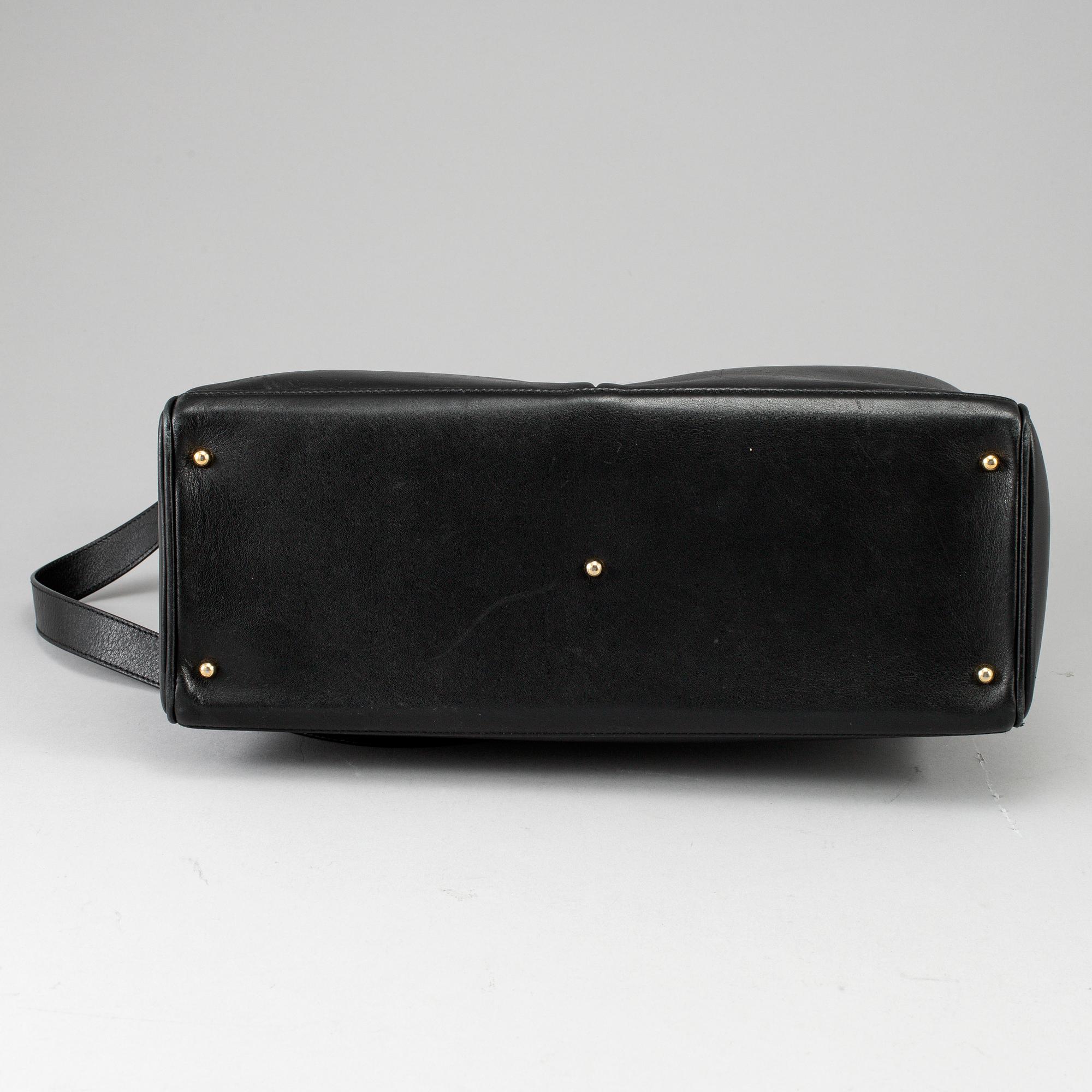 GUCCI, a leather bag/briefcase.