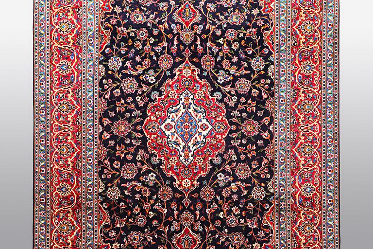 A carpet, Kashan signed Najafi, ca 360 x 231 cm.