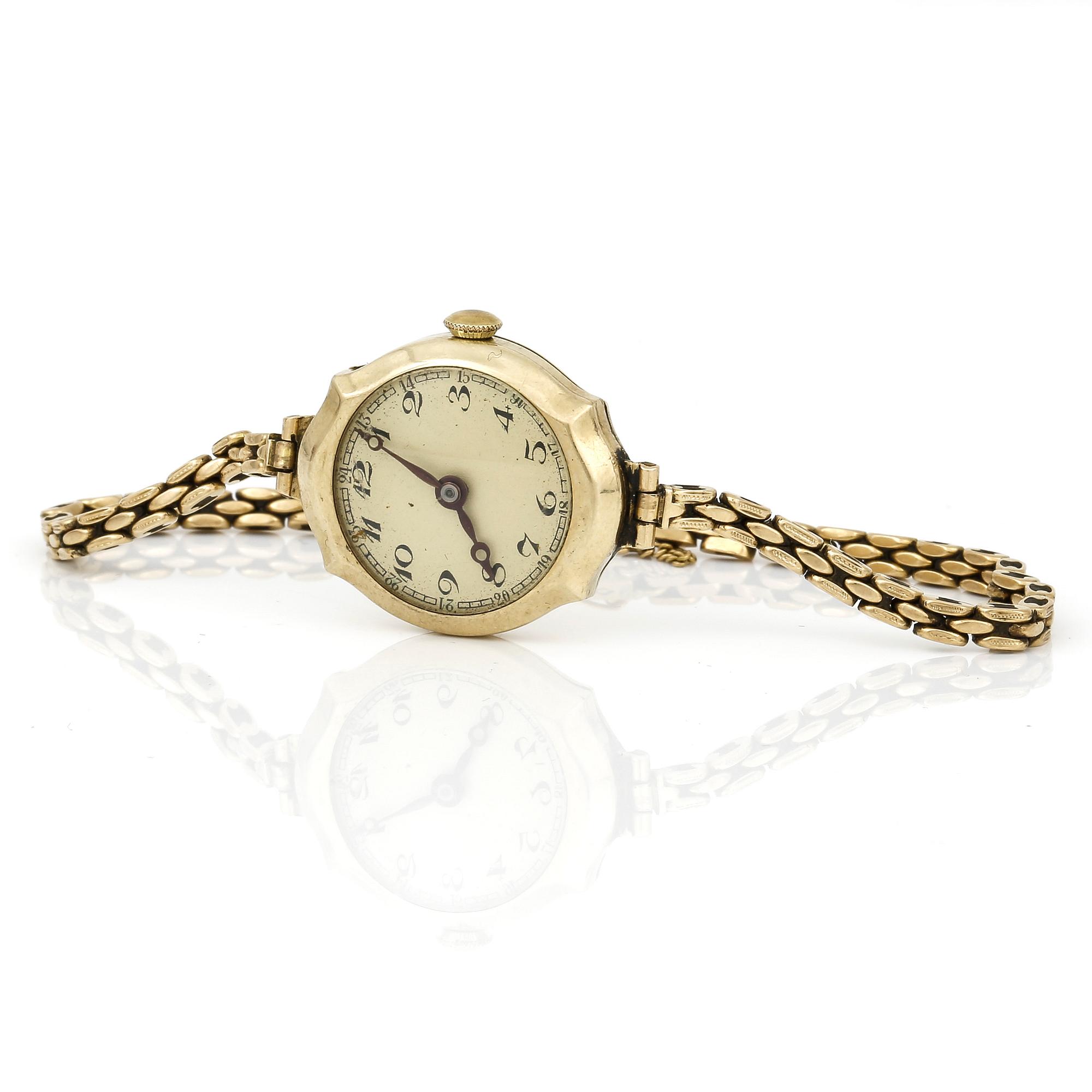 DAMARMBANDSUR, manuell, 14K guld med länk i 18K guld. total vikt ca 19g.