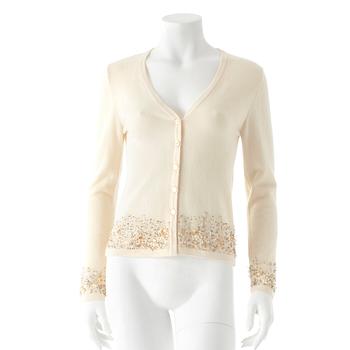 ESCADA, a creme colored wool and cashmere blend cardigan with sequin embellishment.
