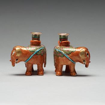 A pair of Canton candle sticks in the shape of elephants, Qing dynasty, 19th century.