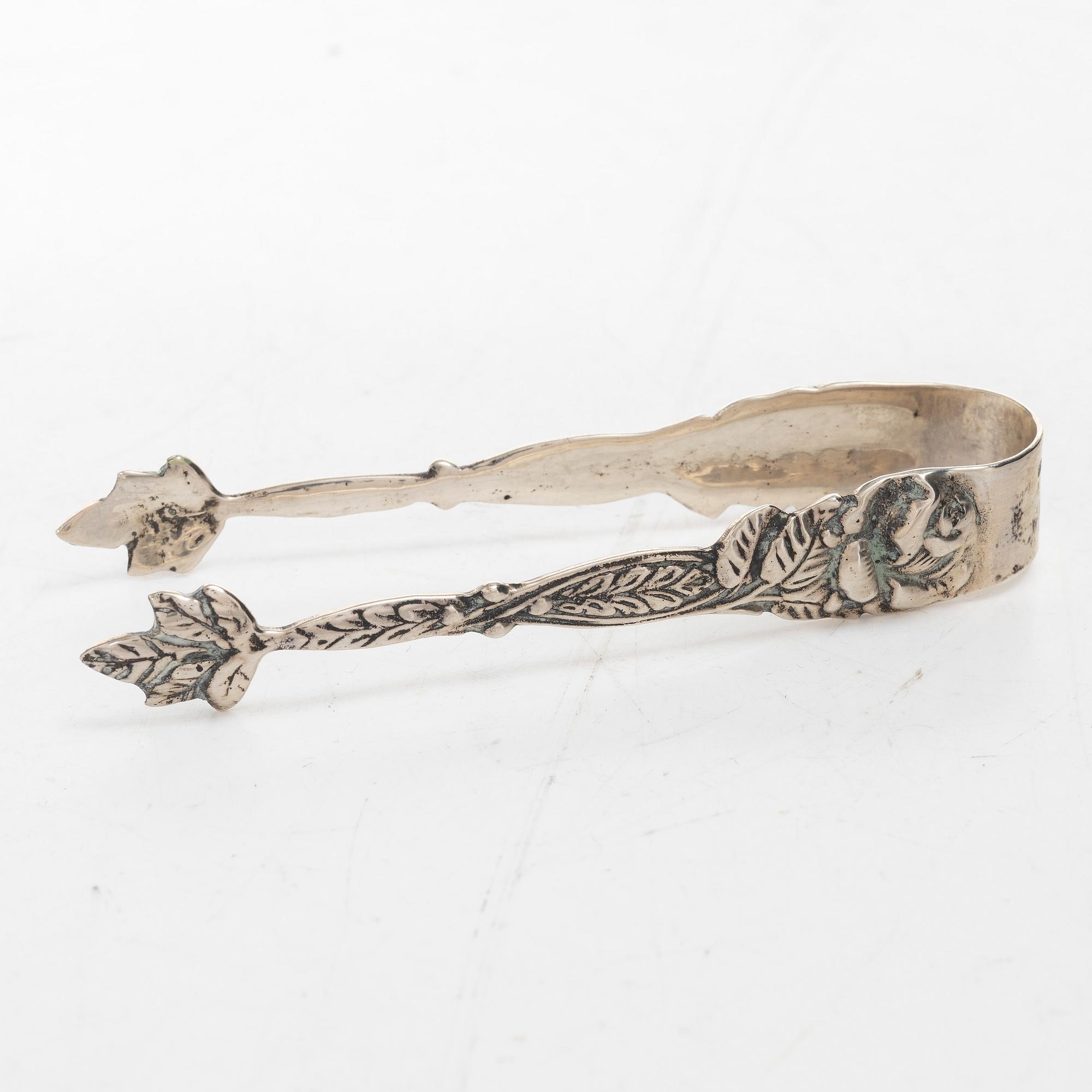 A silver sugar bowl, creamer and sugar tongs, 20th century.