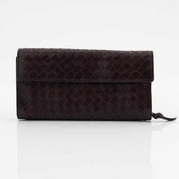 Bottega Veneta, a brown leather wallet.