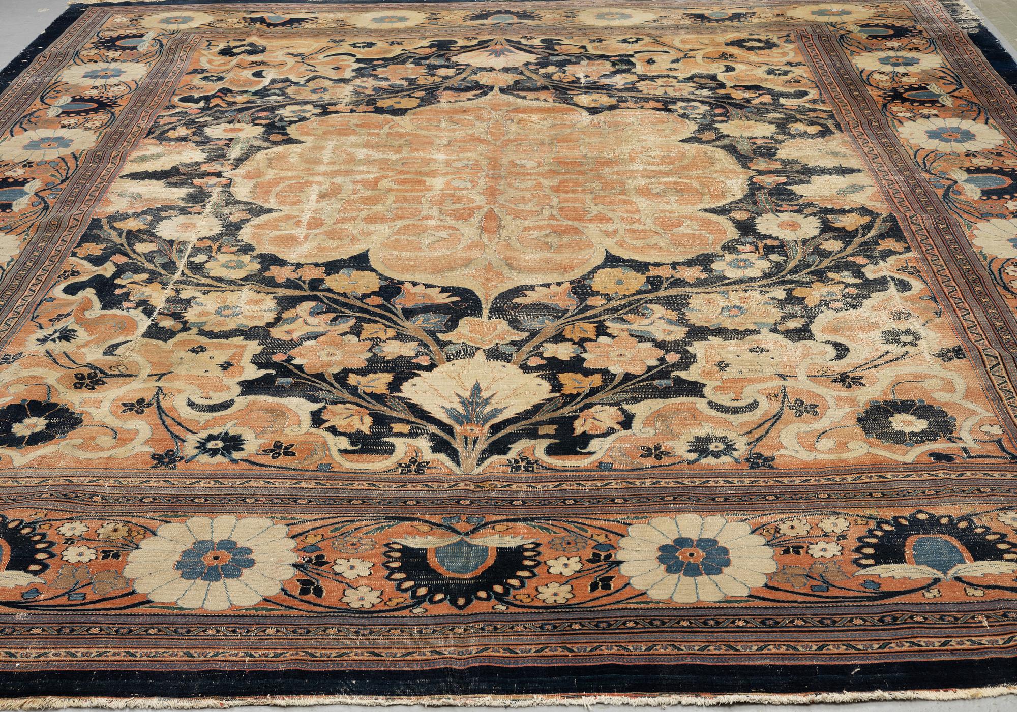 An antique Persian Doroshk carpet, signed, ca 475 x 397 cm.