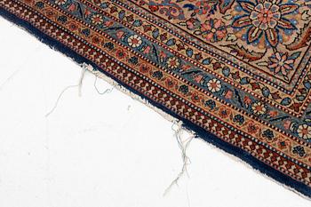 An oriental carpet, c. 425 x 305 cm.