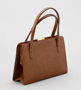 A 1960s/70s brown leather handbag by Gucci.