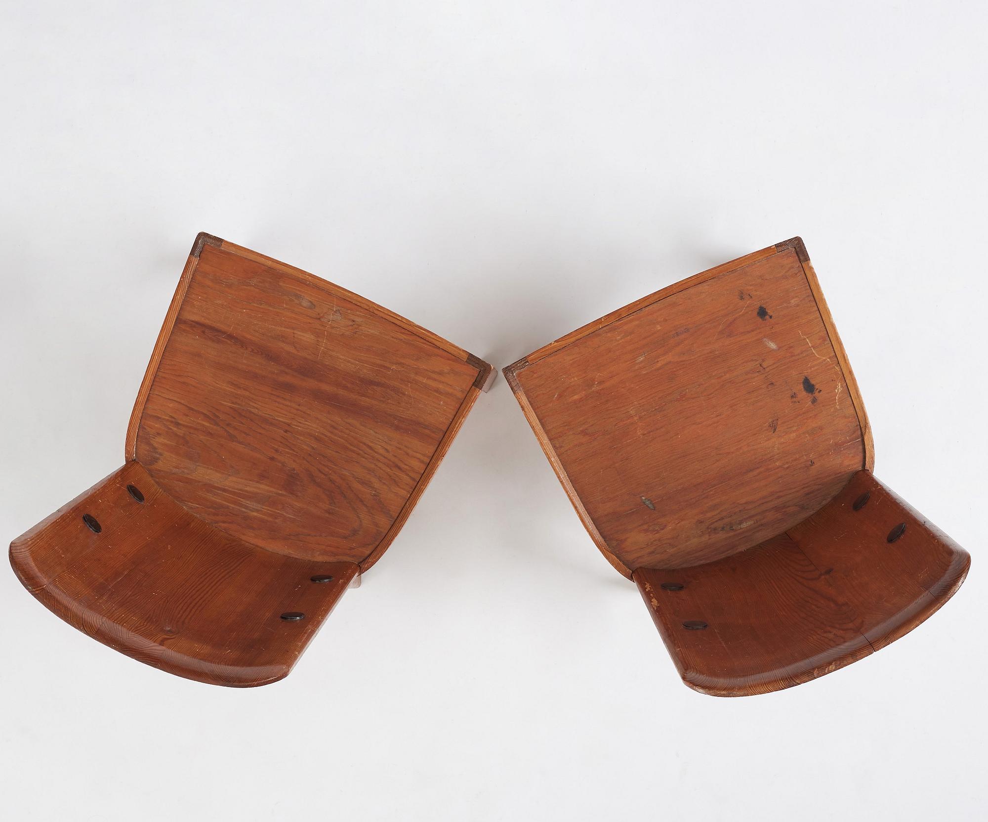 Axel Einar Hjorth, a pair of stained pine 'Lovö' chairs, Nordiska Kompaniet, Sweden 1930s.