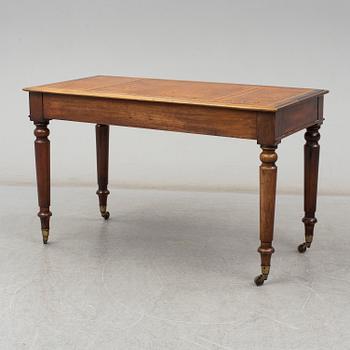 A late 19th century English writing table signed Holland & Sons.