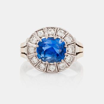 656. A 3.39 ct untreated sapphire and brilliant cut diamond ring. Total carat weight of diamonds 0.55 ct.