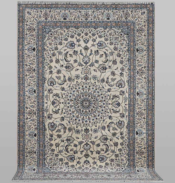 A carpet, Nain, part silk, 9 laa, c. 307 x 203 cm.