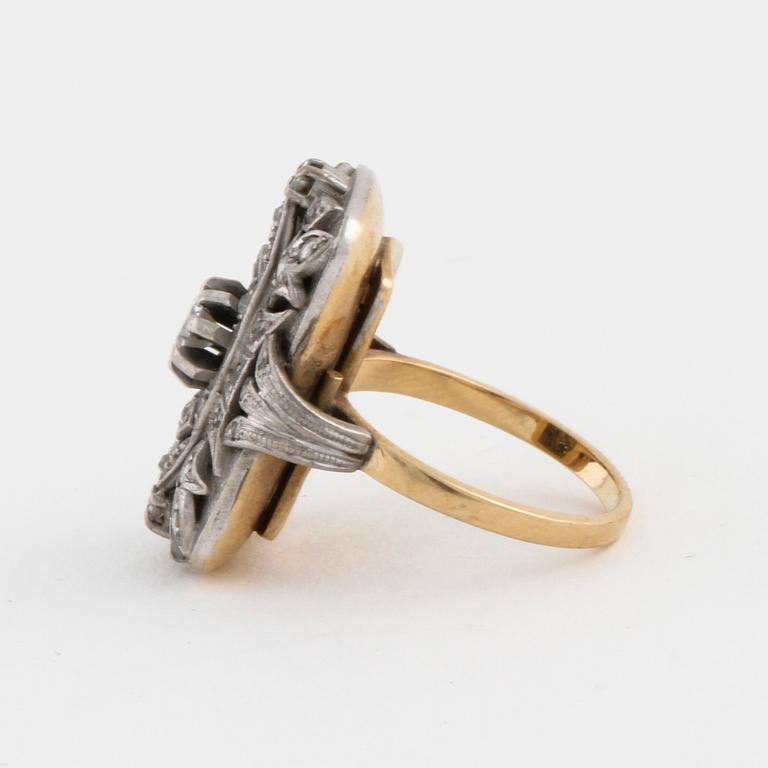 A facet cut diamond ring.