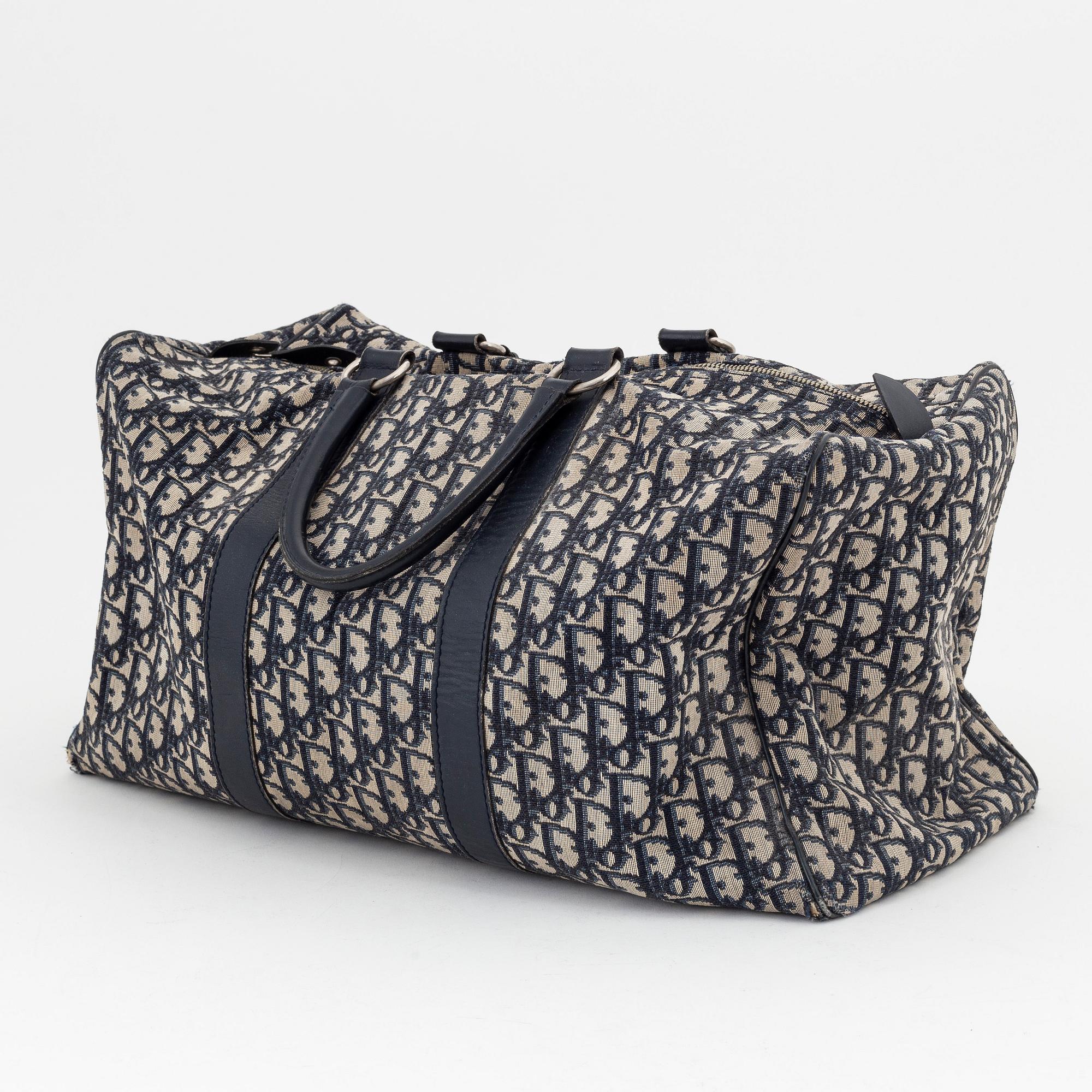 Christian Dior, a canvas 'Speedy' weekendbag and belt, size 85.