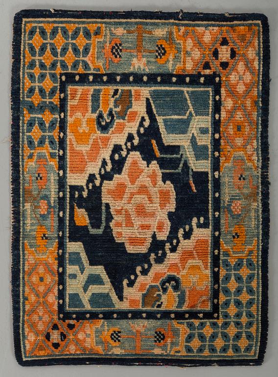 A semaintique Chinese carpet ca 73 x 54 cm.