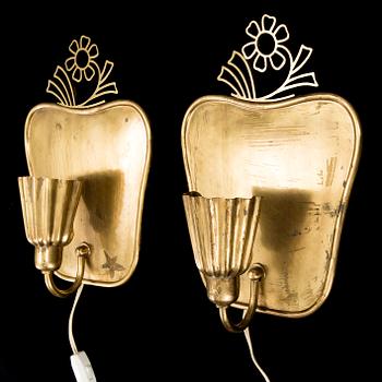 A pair of brass wall-lights by Firma Lars Holström, Arvika.