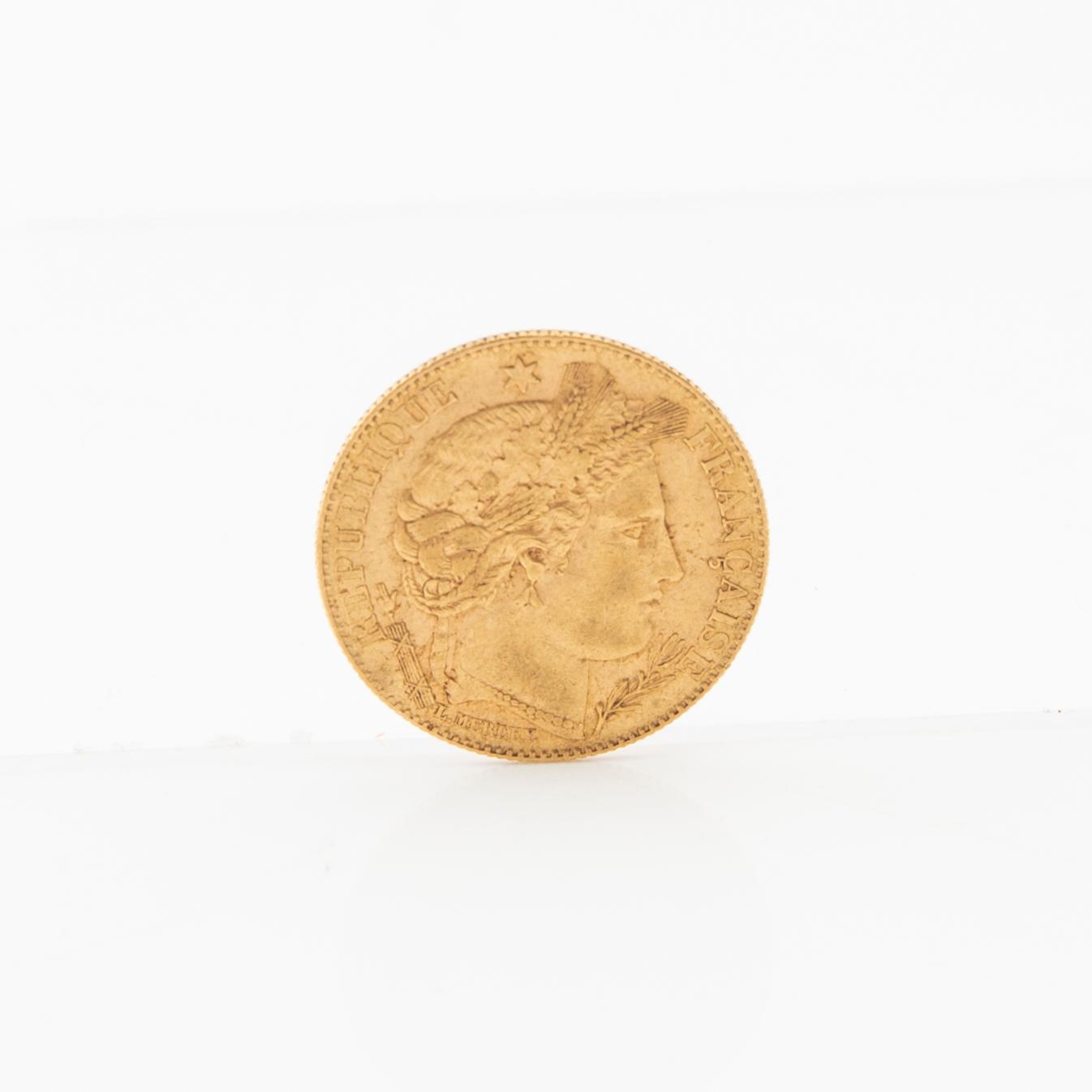 Gold coin 10 francs 1899 France.