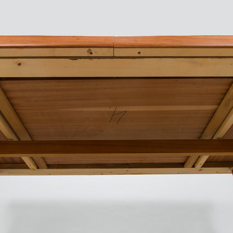 A mid-20th century dining table.