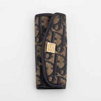 Christian Dior, a canvas handbag, toilet bag and key holder.