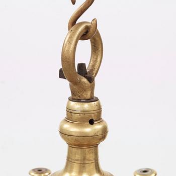 A 19th century eight-light brass chandelier in the manner of Hans Rogiers van Harelbeke.