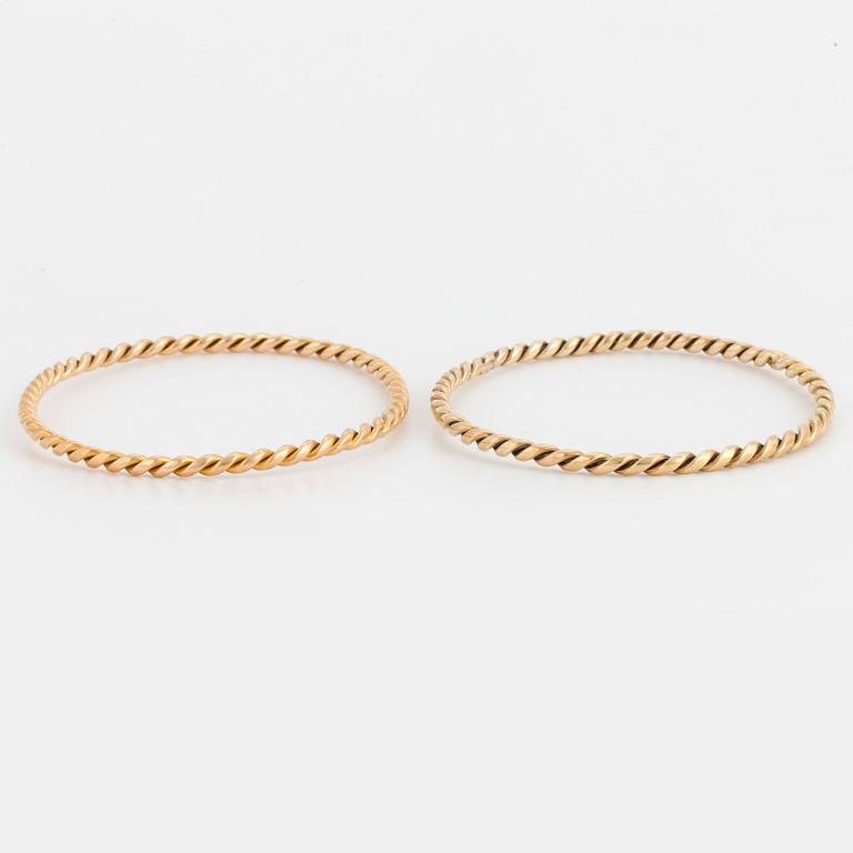 Two 14K gold bangles.