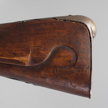 A 18th century flintlock rifle.