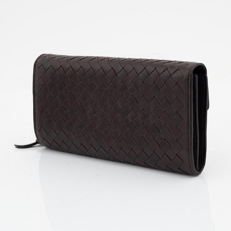 Bottega Veneta, a brown leather wallet.