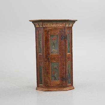 A folk corner cabinet dated 1779.