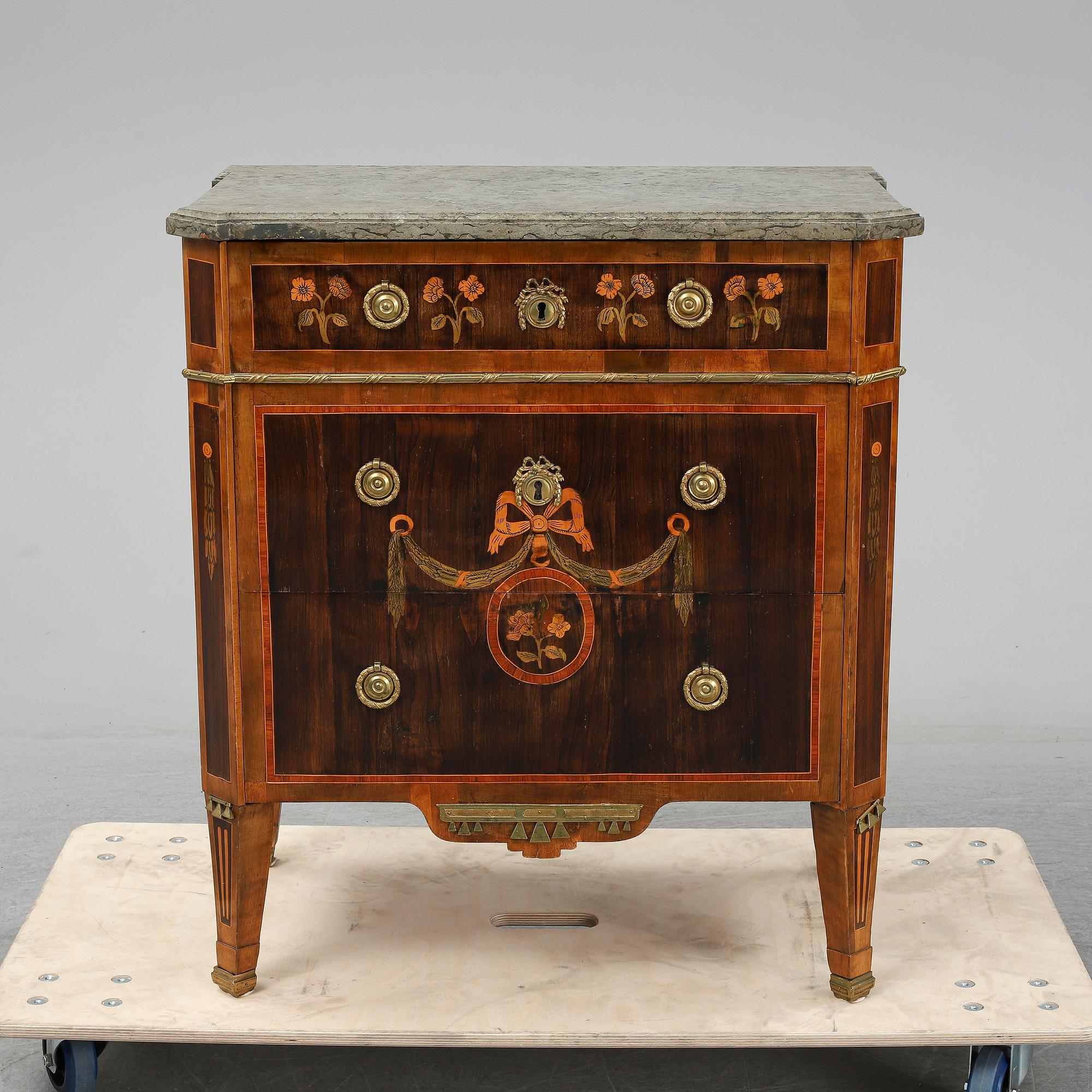 A commode in gustavian style 18 and 20 th century.