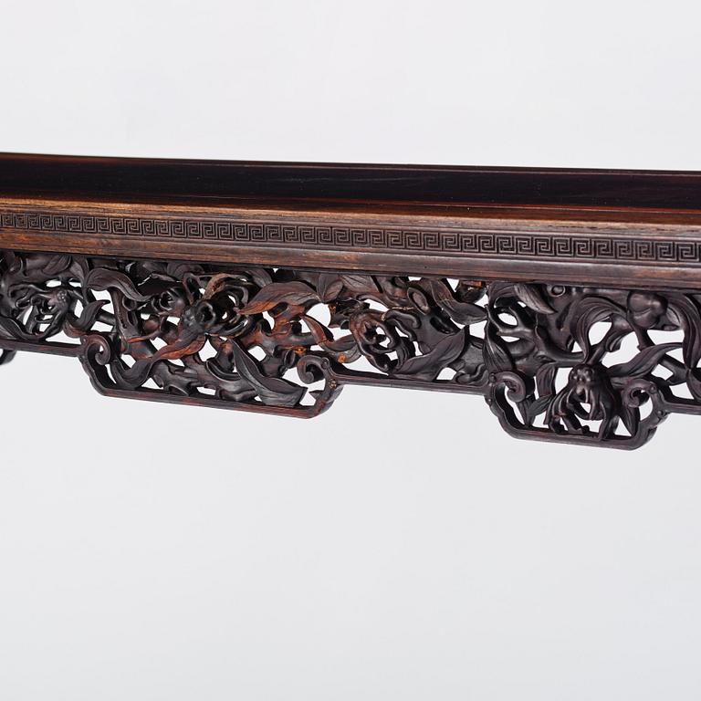 A massive zitan recessed-leg long table 'Jiaotousun Qiotouan', Qing dynasty, 19th century.