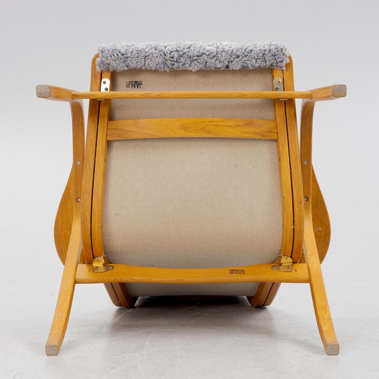 Yngve Ekström, a "Lamino" armchair, Swedese, Sweden, late 20th century.